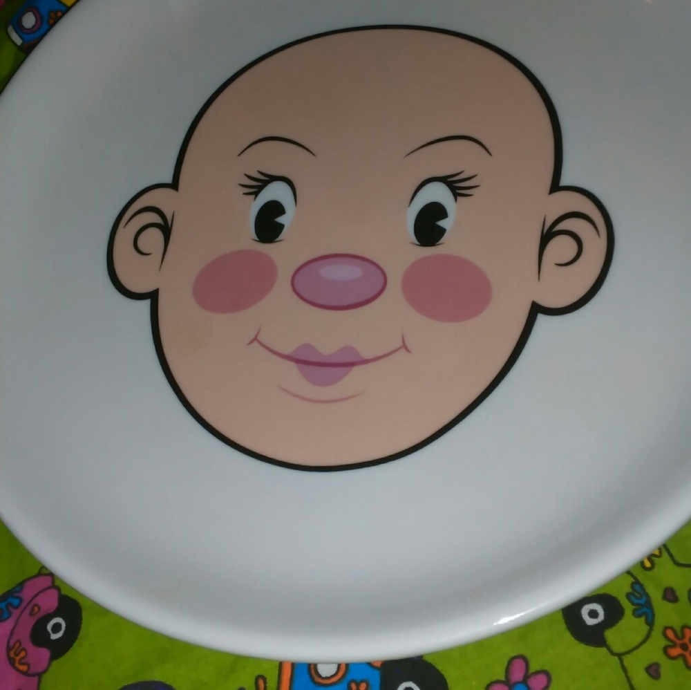 (FRED) PLAYS WITH HIS/HER FOOD PLATE